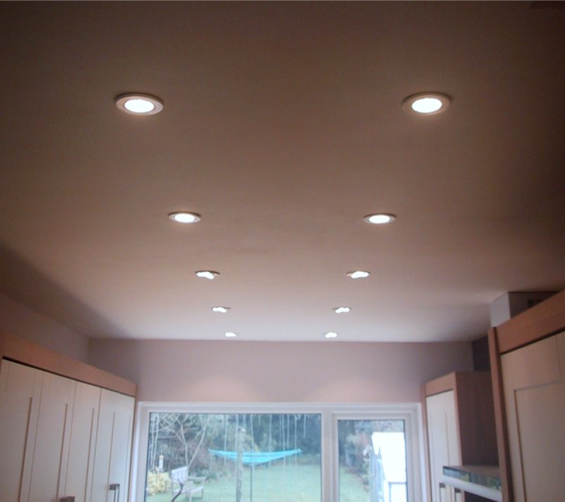 A large galley kitchen fitted with a combination of straight and tilt downlighters