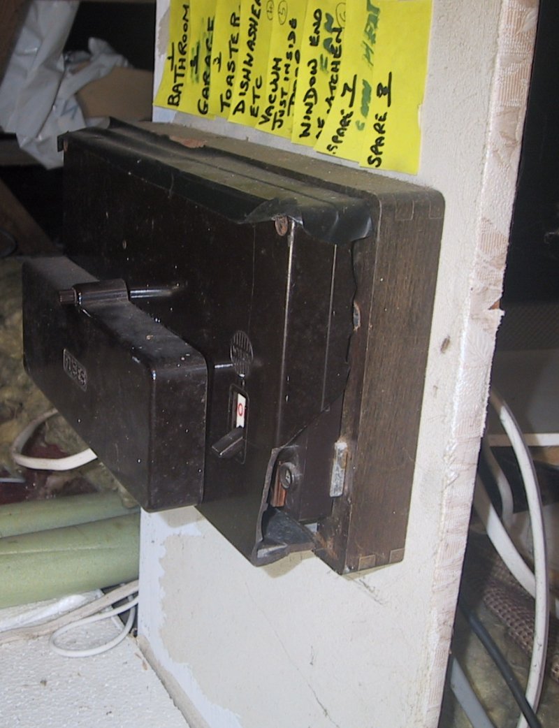 A second fusebox in the loft, this time with a piece of the side broken and missing