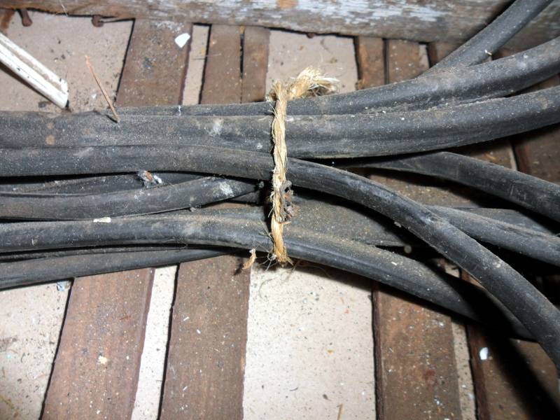 Rubber insulated cables bundled together and tied with string