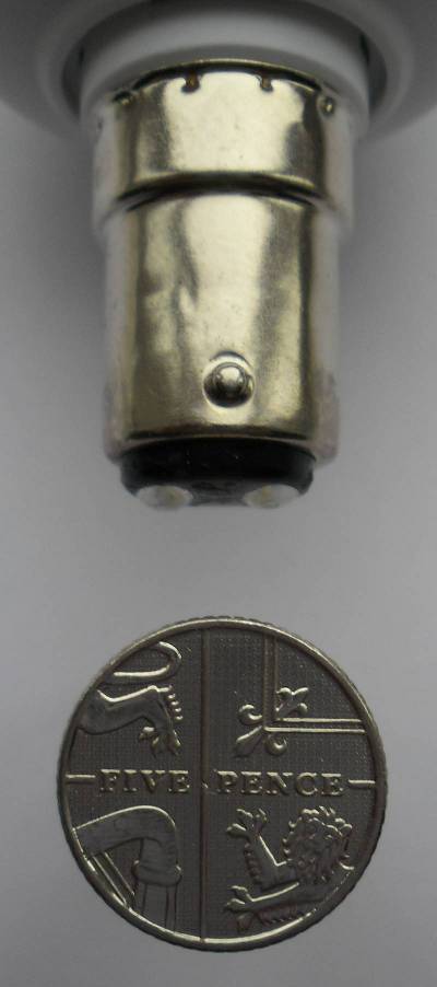 photograph of an SBC base compared to a coin