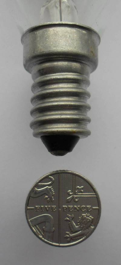 photograph of an SES base compared to a coin